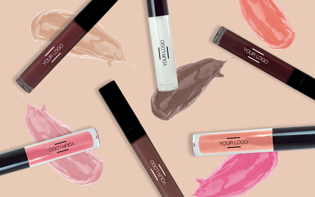 Flat lay of customizable lip glosses and lip oils in various shades, paired with swatches, highlighting the comeback of glossy lip trends