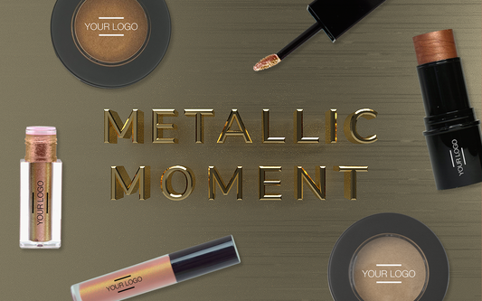  "Metallic Moment" showcased with customizable beauty products like highlighter, lip gloss, and eyeshadow, all in shimmering metallic tones—perfect for bold branding