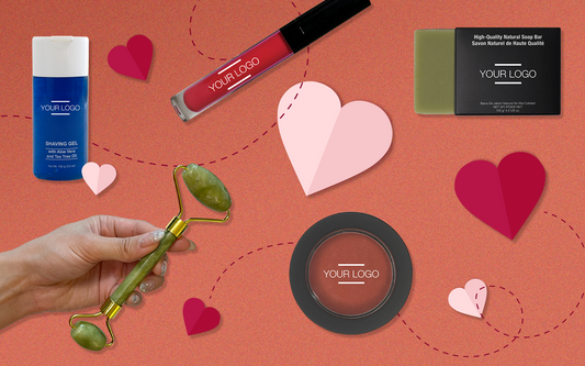 Valentine's-themed flat lay of customizable beauty products, including lipstick, jade roller, and soap, surrounded by heart graphics—perfect for seasonal branding