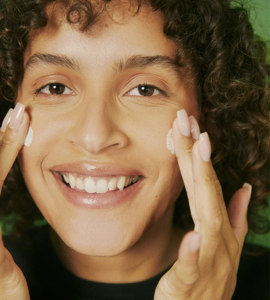 Applying private label Skincare to woman's face using Blanka