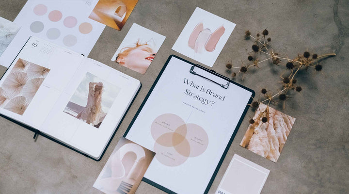 Flat lay of brand strategy materials, including mood boards, color palettes, and a Venn diagram, highlighting the creative process of building a cohesive brand identity