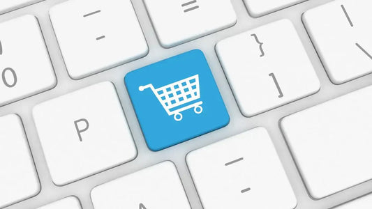 Close-up of a keyboard with a blue shopping cart key, symbolizing e-commerce and compelling call-to-action design