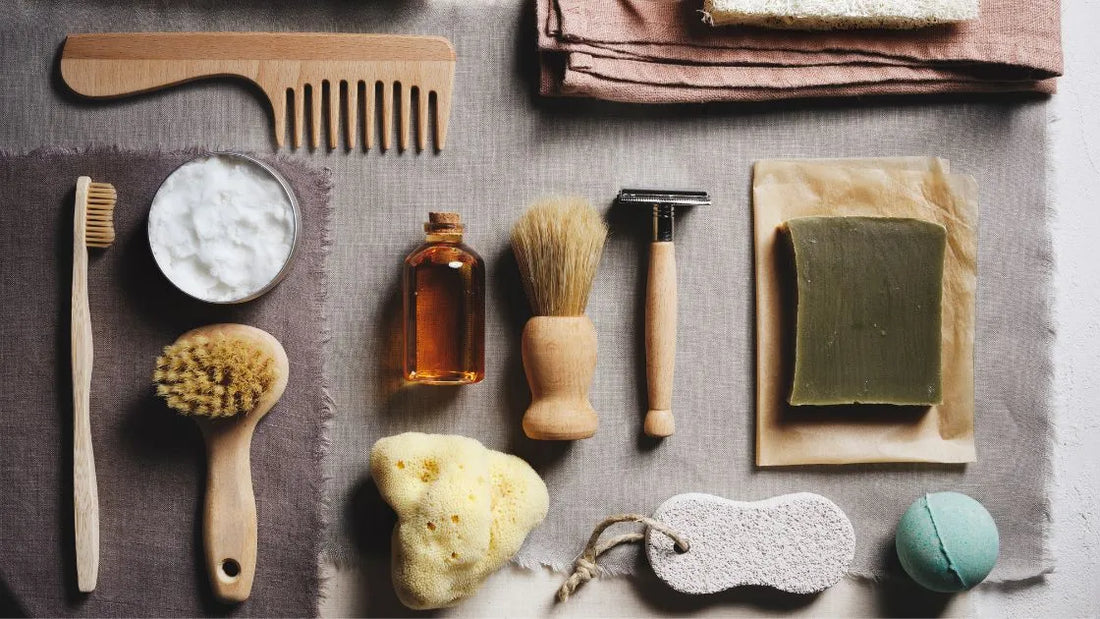 Flat lay of natural men's grooming essentials, including brushes, soap, oil, and a comb, showcasing sustainable and white-label product opportunities