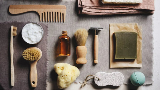 Flat lay of natural men's grooming essentials, including brushes, soap, oil, and a comb, showcasing sustainable and white-label product opportunities