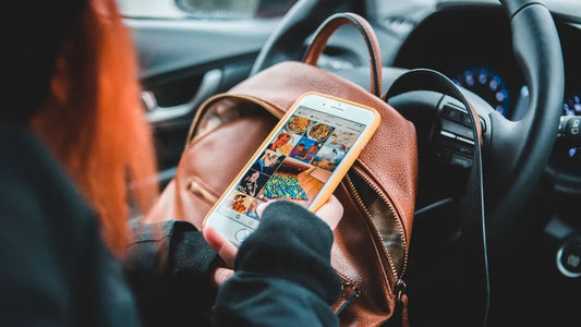 Girl looking at her social media grid on her iphone