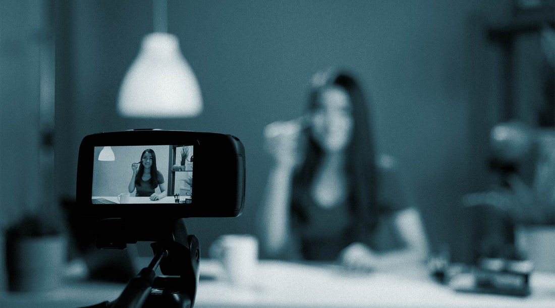 Camera recording a beauty influencer in a dimly lit room, emphasizing the importance of user-generated content (UGC) for makeup and skincare brand marketing