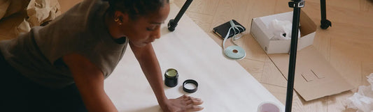 a woman working on a white canvas being artistic