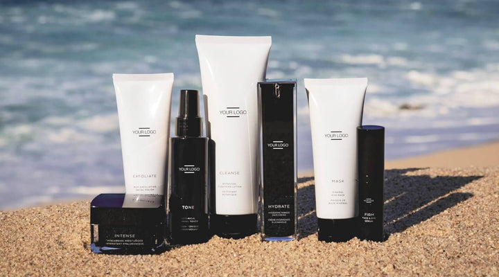  A sleek lineup of skincare products showcased on a beach, ideal for promoting premium private-label collections