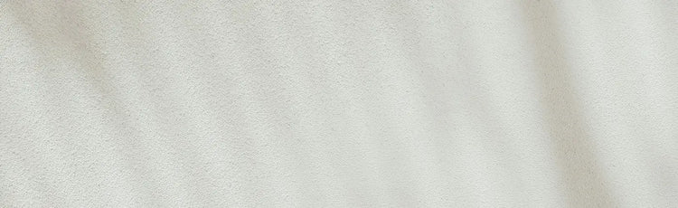 Plain white stand stone wall.