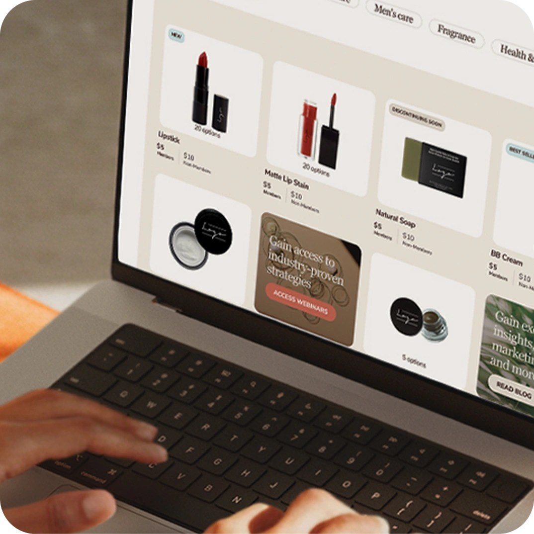 Person using a laptop with a cosmetic product website open on the screen.