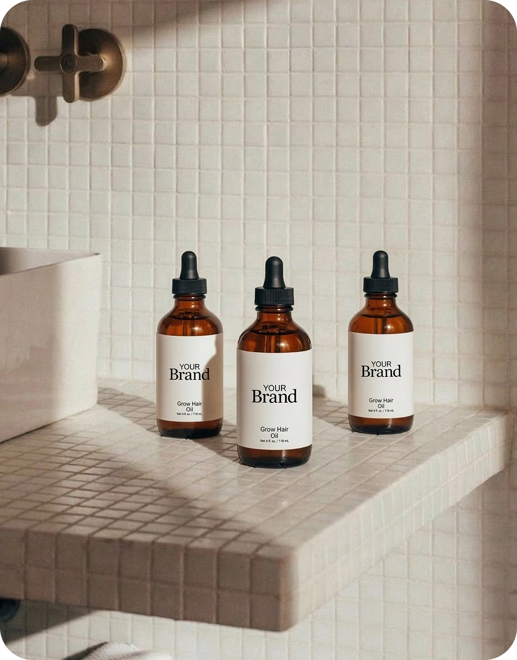 Three bottles of 'Natura Brand' on a bathroom shelf with tiled walls.