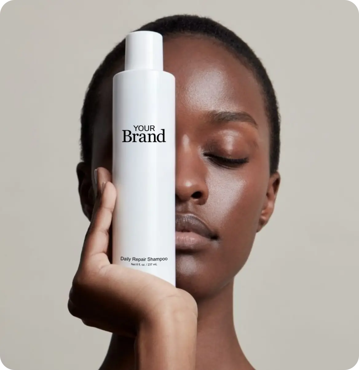 Person holding private label branded professional hair care product 