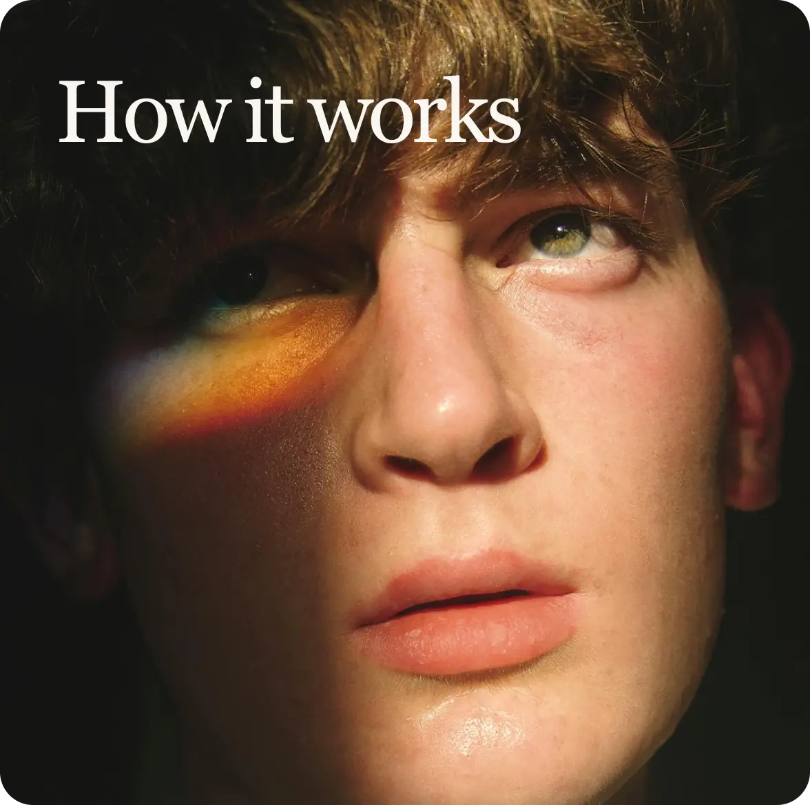 Close-up of a person's face with a colorful light effect, text 'How it works' above.