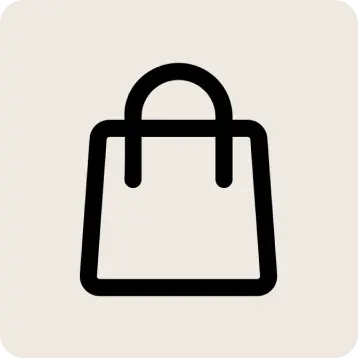 A minimalist black shopping bag outline icon centered on a light warm gray background.