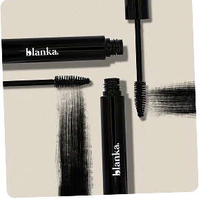 Makeup artist tools including brow pencils, mascara, and cosmetic products on neutral background