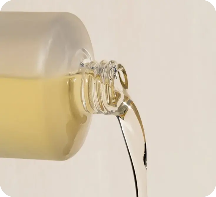 Pouring luxury hair treatment oil for professional salon application