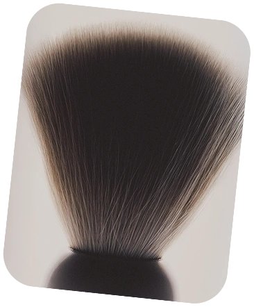 Makeup brush with black bristles on a white background
