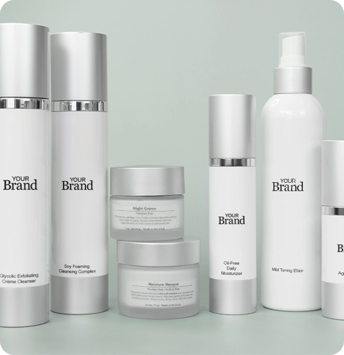 Professional white label skincare product line with minimalist packaging including serums, lotions, and treatment bottles