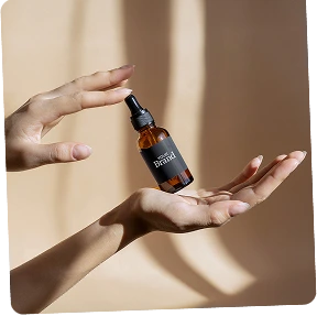 Luxury skincare oils and serums in amber glass bottles with natural ingredients