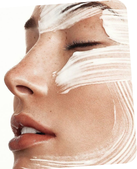 Close-up of a person's face with white makeup on the right side