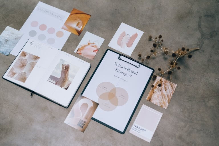Skincare branding plans laid out on floor